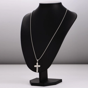 Minimalist silver stainless steel cross pendant necklace displayed on a black bust mannequin