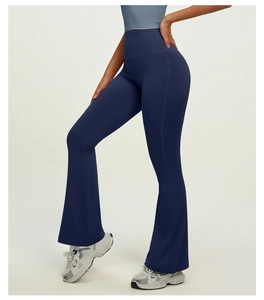 Detailed side view of high-waisted dark blue flared yoga pants with body-shaping fit