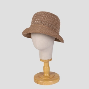 Detailed view of brown linen knit fisherman hat with white dotted stitching details