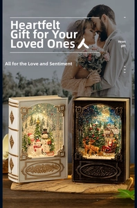 Detail of Christmas book-shaped lantern gift featuring snowman and Santa inside
