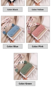 Close-up of multicolor crossbody bags with wide embroidered straps and round buckles