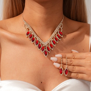 Luxurious two-piece jewelry set with ruby-colored teardrop pendants and white diamonds