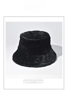 Detail of soft black plush bucket hat showing thick faux fur texture for winter warmth