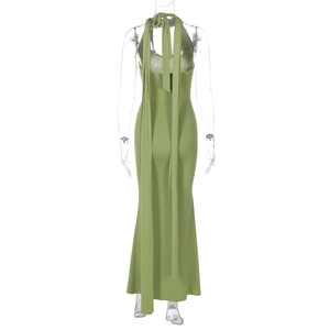 Detail of green halter neck maxi dress featuring long back ties and a slim fit cut