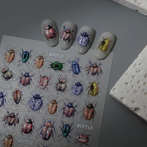 Realistic 3D beetle nail art stickers with vibrant colors on transparent background