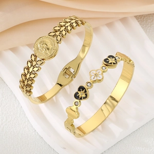 18K gold plated vintage bangle featuring a four-leaf clover and heart coin design