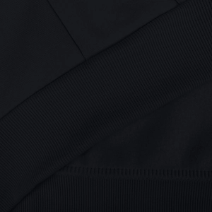 Detailed close-up of men's black thermal hoodie fabric showing ribbed cuffs and warm fleece lining