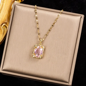 Luxurious gold chain necklace featuring a rectangular pink crystal gemstone pendant