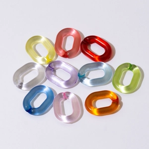 Close-up of colorful oval acrylic open chain links for DIY jewelry and bag accessories