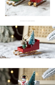 Detail view of festive metal sled ornaments with miniature reindeer, snowmen and trees