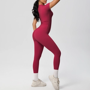 Detailed side view of dark red seamless high-waisted yoga pants and short sleeve gym set
