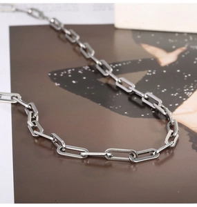 Macro view of polished silver rectangular chain links with high gloss metallic finish
