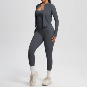 Deep grey three-piece yoga set including zip-up jacket, sports bra and leggings