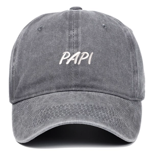 Detail of white PAPI embroidery on a vintage charcoal gray washed cotton baseball cap