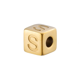 Macro shot of 14K gold plated stainless steel cube bead with letter S for DIY jewelry