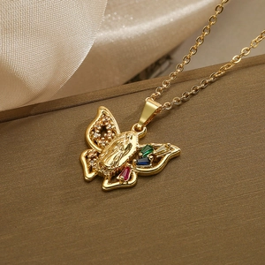 Golden butterfly necklace with Virgin Mary relief and colorful crystals on silk