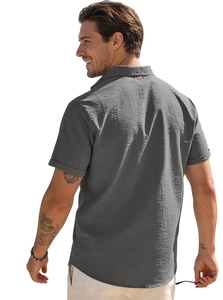 Detail view of the gray textured fabric and shoulder tailoring on a short sleeve shirt