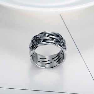 Macro view of vintage silver stainless steel ring featuring a detailed woven texture design