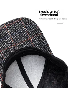 Detail view of cotton sweatband on a plaid baseball cap with premium stitching