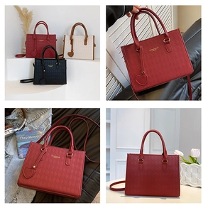 Detail of quilted tote bag with heart pendant and gold hardware in various colors