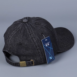 Washed black denim baseball cap with adjustable metal buckle shown from side and back