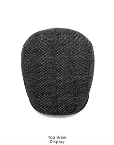 Top view of a grey plaid newsboy cap showing detailed woven wool fabric texture