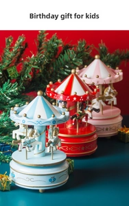 Detailed view of carousel music boxes in blue, red, and pink for festive home decoration