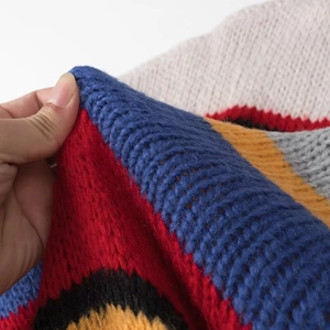Rainbow striped knit sweater with loose fit and vibrant multicolored pattern design