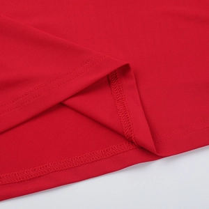 Close-up of double-needle hem stitching on a red bodycon dress showing high-quality fabric