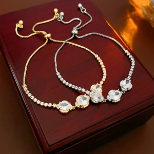 Detail of adjustable flower bracelet showing oval cubic zirconia and sliding bead closure