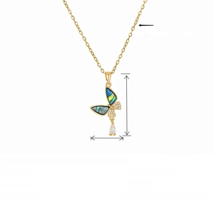 Detail view of titanium steel butterfly pendant with abalone shell and crystal drop charm