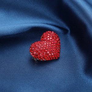 Elegant red heart rhinestone brooch pinned on deep blue satin for Valentine gift