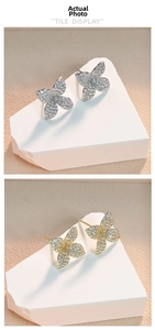 Macro detail of tulip butterfly earrings with AAA zircon micro-pave in gold and silver