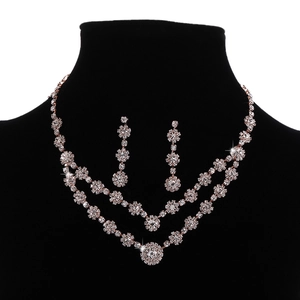 Elegant rose gold double necklace and drop earrings set with shimmering white zircons