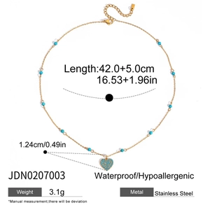 Detail shot of golden stainless steel necklace with blue stone heart pendant and sizing data