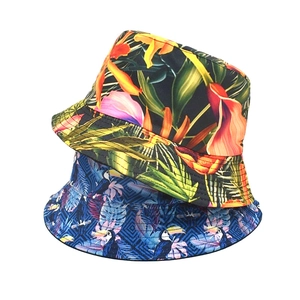 Reversible bucket hat with tropical floral and toucan prints for sun protection