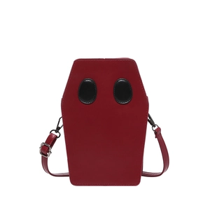 Quirky red coffin-shaped crossbody bag with unique ghost face patchwork design