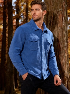 Detail of blue fleece tactical jacket featuring double chest pockets and warm fabric texture