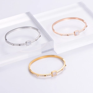 18K gold plated bangle with square diamond accents in gold, silver, and rose gold colors