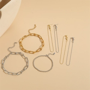 5-piece gold and silver paperclip chain bracelet set with matching tassel drop earrings