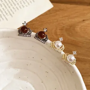 Elegant crown pearl stud earrings with zircon inlay in gold and gunblack finishes
