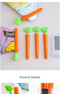 Detail of carrot-shaped magnetic food sealing clips on a refrigerator with storage box