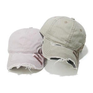 Close-up of distressed brim details and ROSE embroidery on vintage washed baseball caps