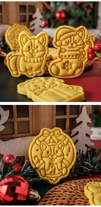 Detailed view of Christmas Corgi cookies with festive scarf and holiday stocking designs