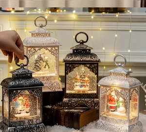 Close-up of vintage Christmas lanterns with Santa and snowman in warm holiday scene