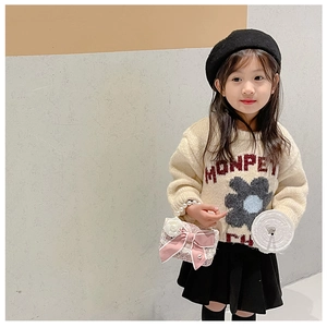 Pink tweed kids handbag with bow and pearl chain styled with knit sweater and beret