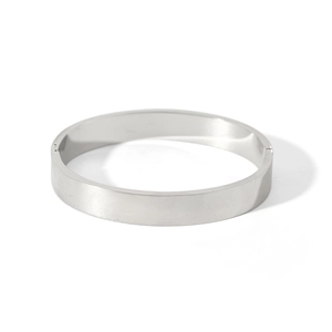 Detailed view of silver minimalist bangle with a polished mirror finish and secure clasp