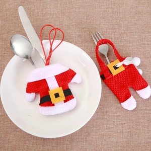 Christmas silverware holder set with Santa style mini clothes and pants on table