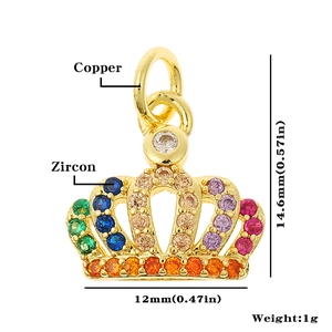 Detail of golden crown pendant with colorful zircons showing precise size and copper material