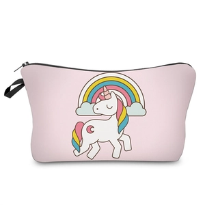 Detail view of the colorful unicorn and rainbow print on a pink makeup bag storage pouch